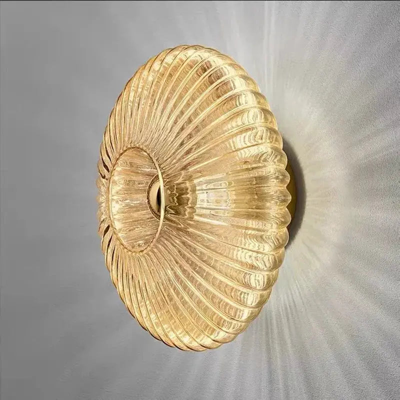 Nordic LED glass wall sconce; gold ribbed circular design with ambient wall lighting