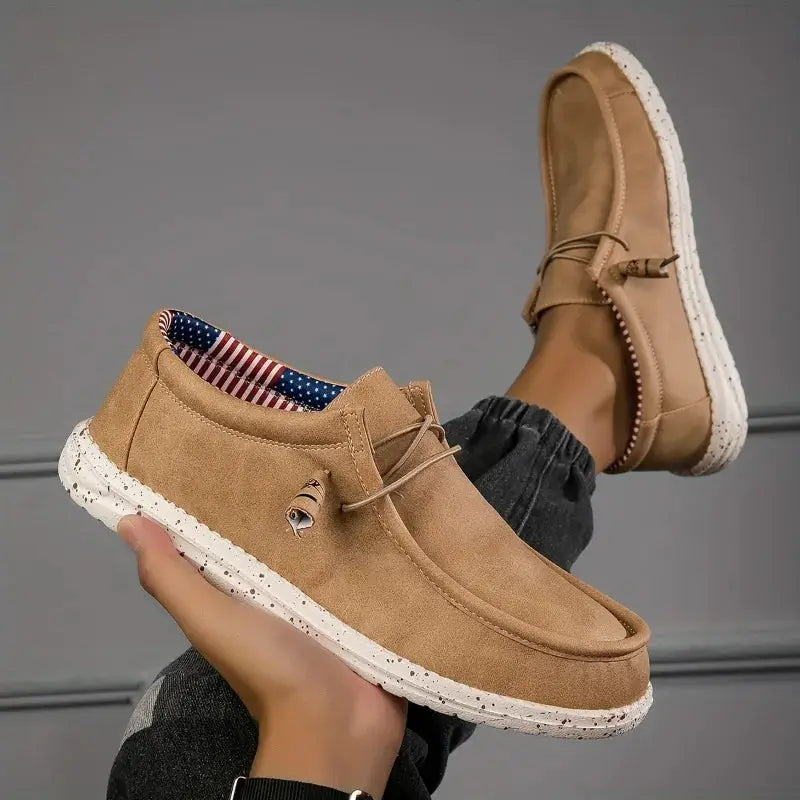 Men's loafers, tan suede with white speckled sole, slip-on casual boat shoes; two shown.