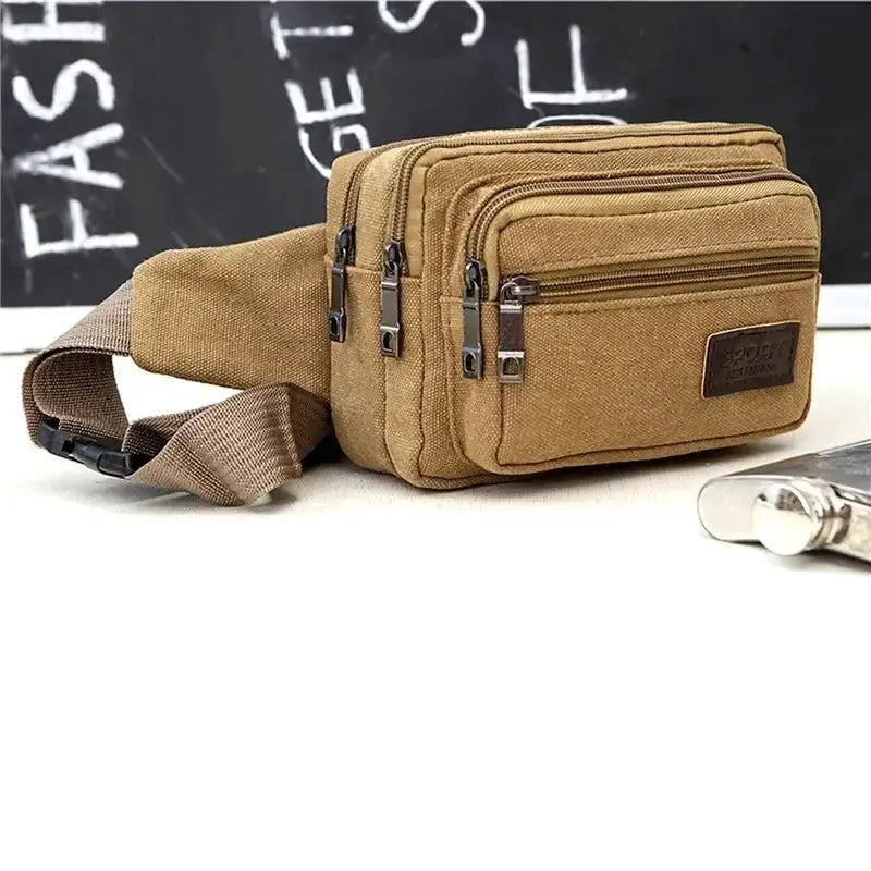 Canvas waist bag with multiple zip compartments in tan, adjustable strap for outdoor use, rugged and durable