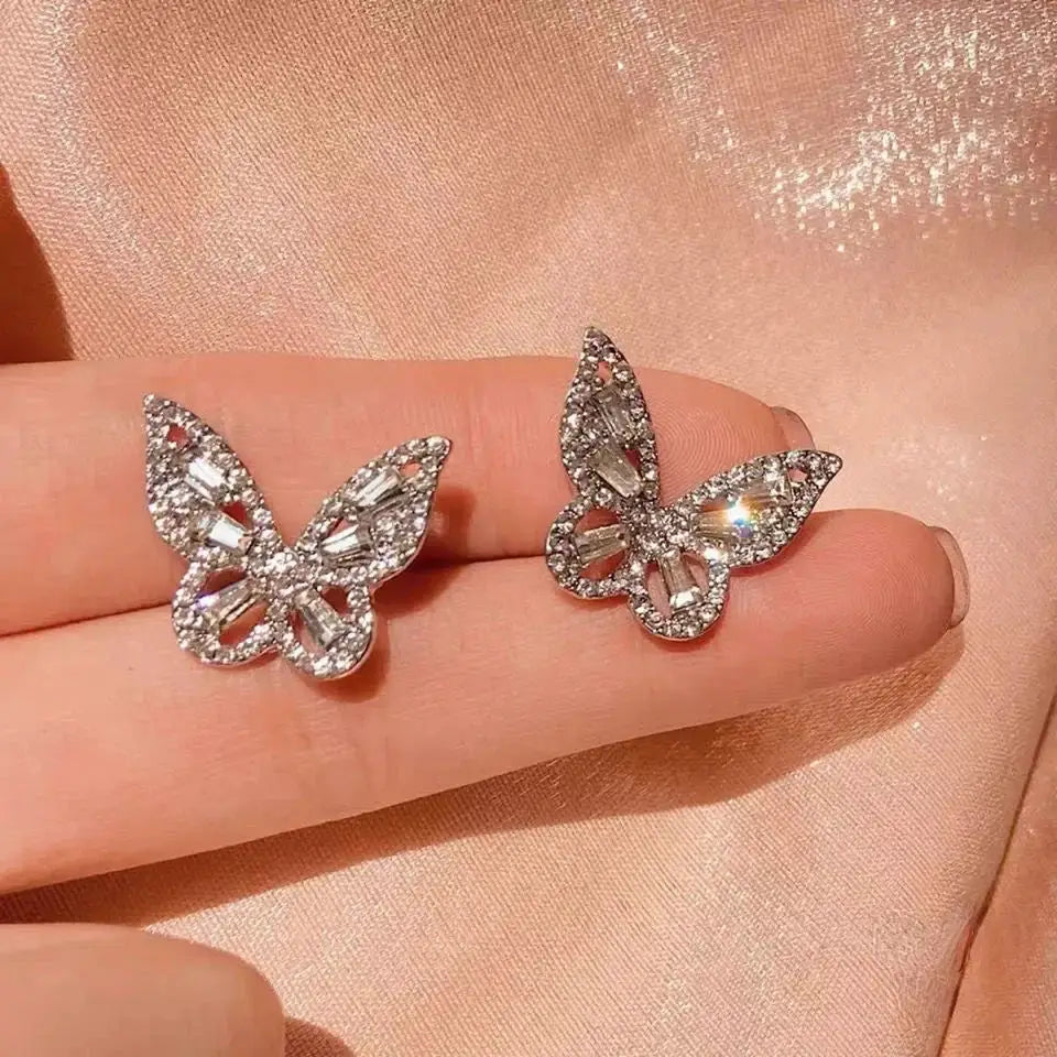 Pair of punk geometric zinc alloy butterfly stud earrings with clear crystals, silver-tone for women