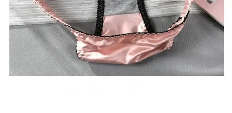 Pink satin girls panties with black elastic waistband and trim