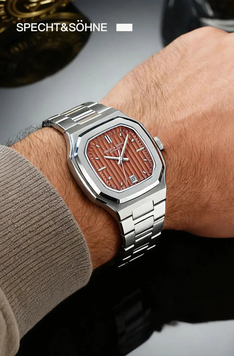 Specht&Söhne stainless steel watch with copper textured dial, 37mm automatic movement, date window, on metal bracelet.