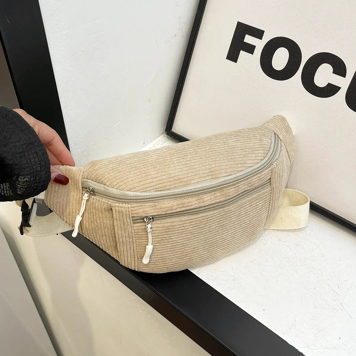 Waist bag in beige corduroy with dual-zip pockets and adjustable strap