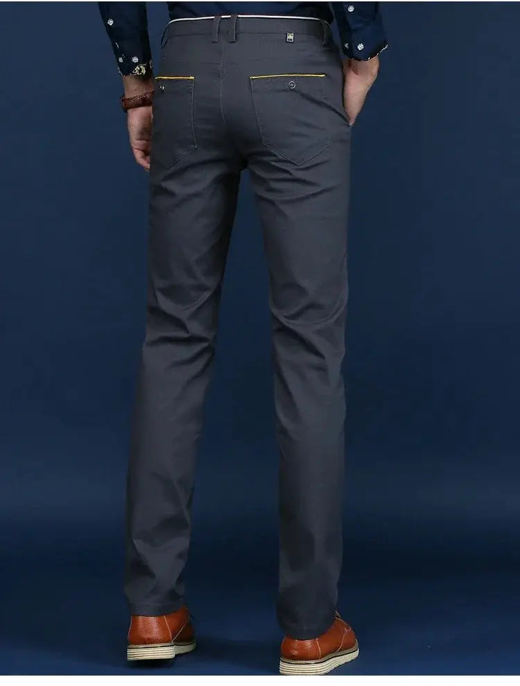 Men's dark gray cotton trousers with yellow back-pocket piping, slim fit