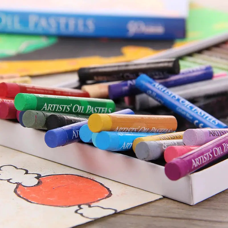 Artists' oil pastels set in a white tray with colorful sticks in green, blue, orange, and purple hues.