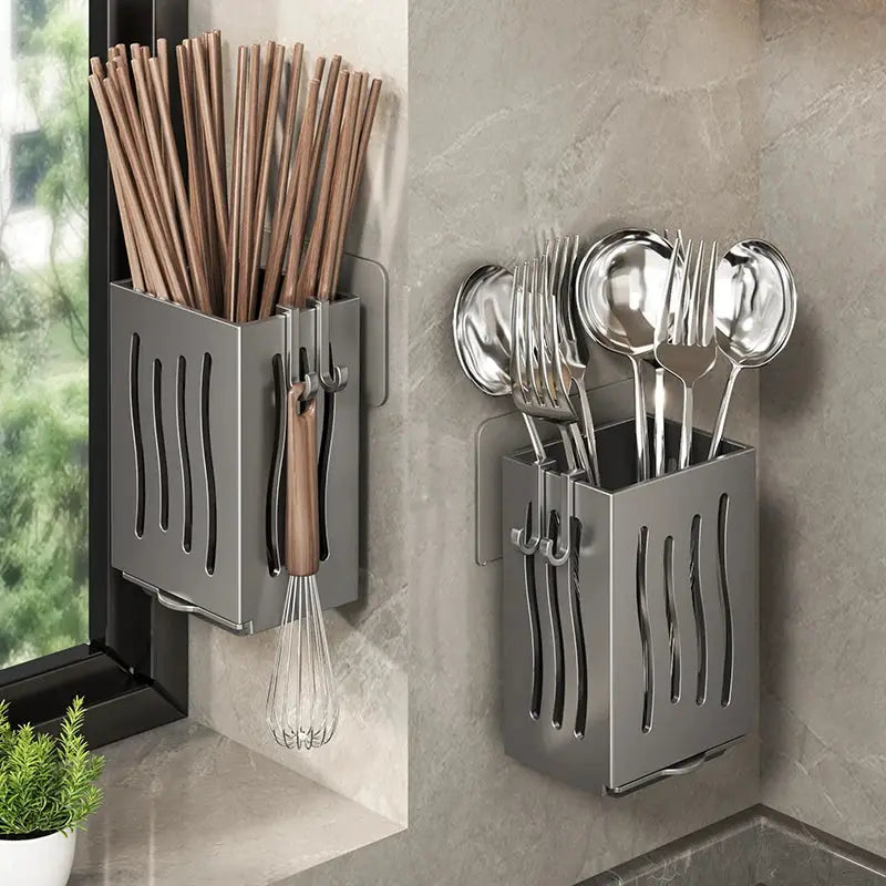 Two gray metal wall-mounted chopstick and utensil storage boxes with hooks