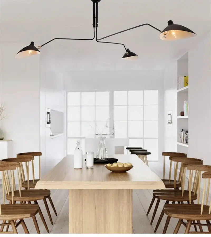 Mouille ceiling lamp Nordic spider pendant, black 3-head design over a wooden dining table