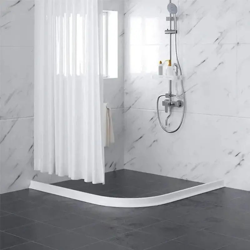 Simples Market silicone bendable water-retaining shower strip in white, curving along a tiled bathroom floor.