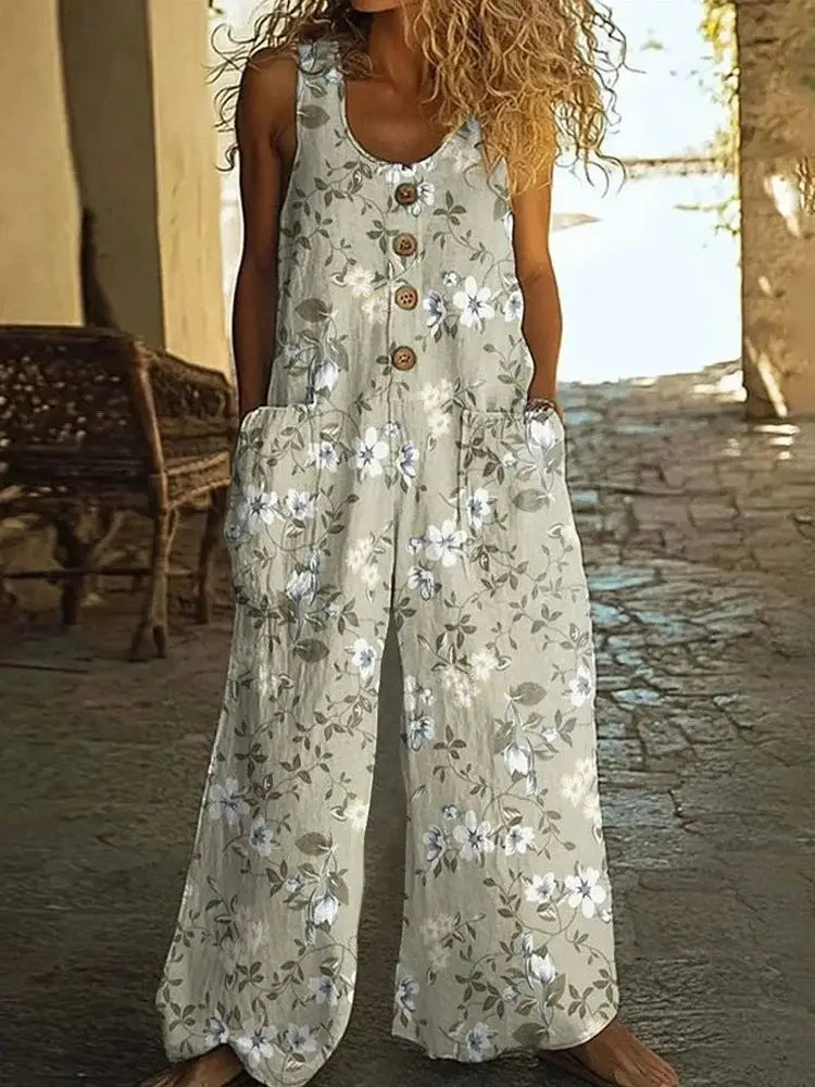 Jumpsuit by Simples Market beige-green floral print, sleeveless with button front, pockets, wide-leg.
