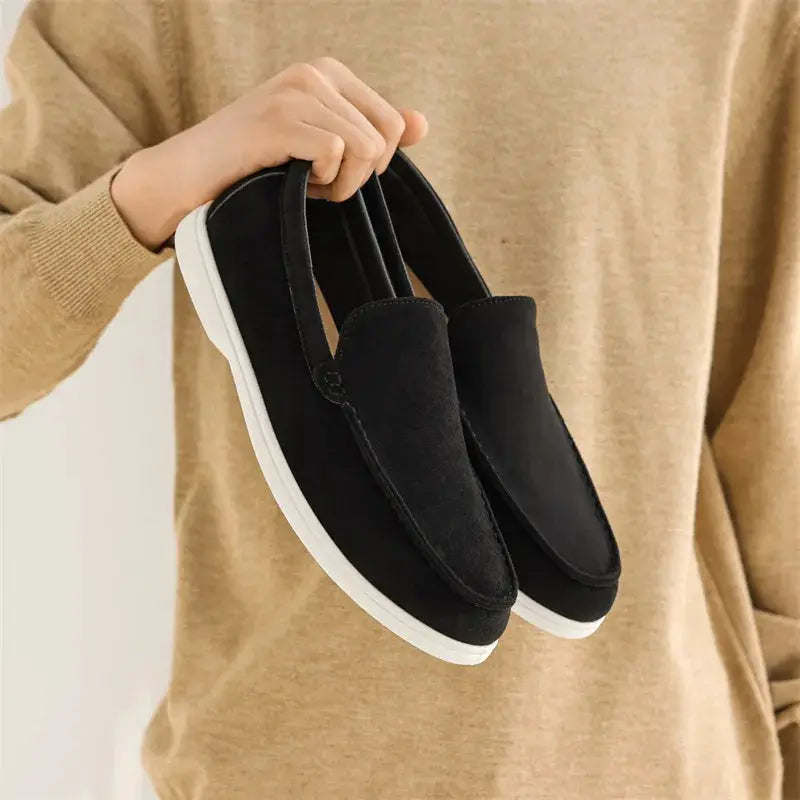 Men's black suede leather loafers with white soles; one pair of casual slip-on moccasins.