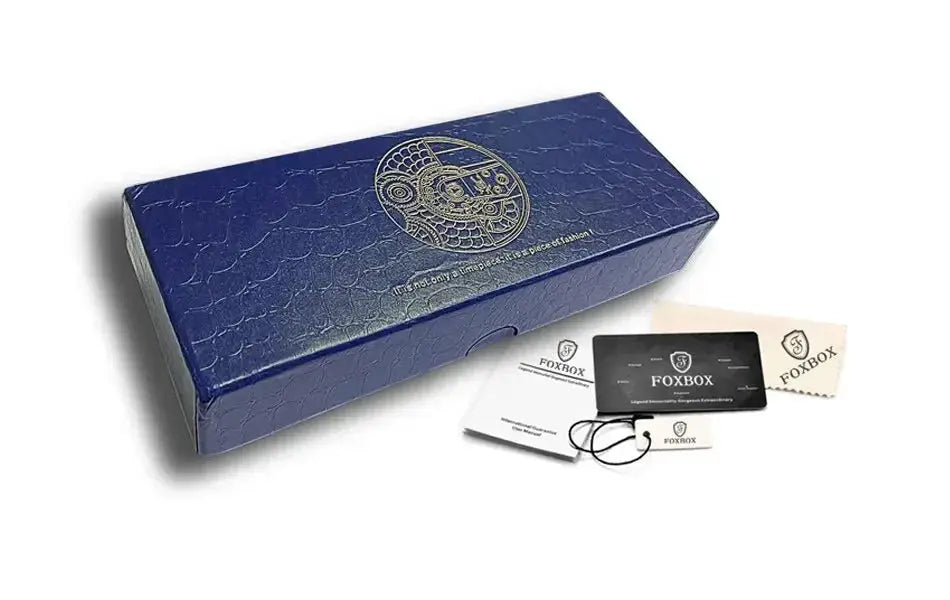 FOXBOX watch packaging: blue textured box with FOXBOX logo, plus manuals and warranty cards.