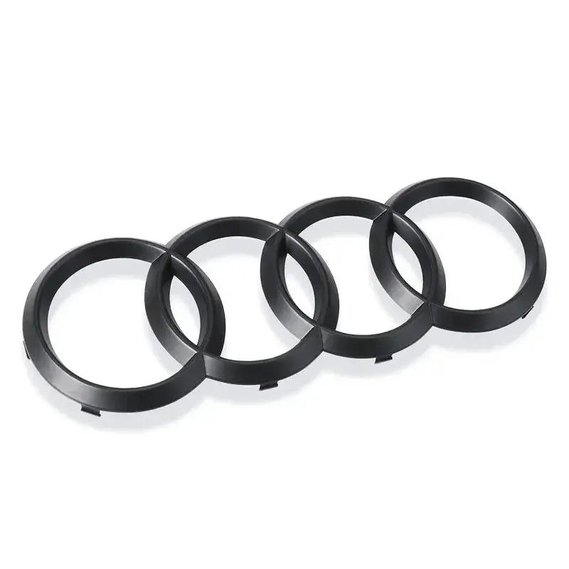 Four black Audi four-ring logo emblem rings, ABS plastic, 4-piece decal set.