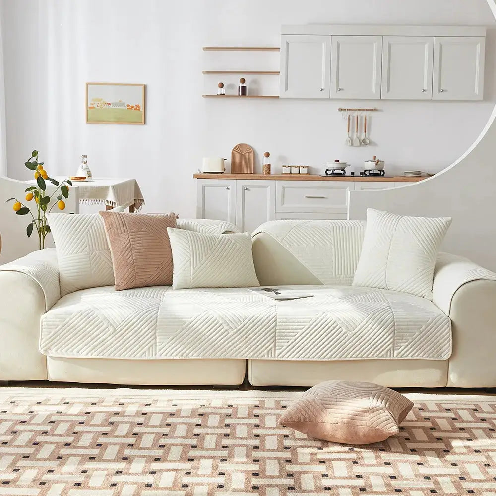 Crystal velvet sofa cover in ivory with geometric quilted pattern, non-slip protection for living room couches