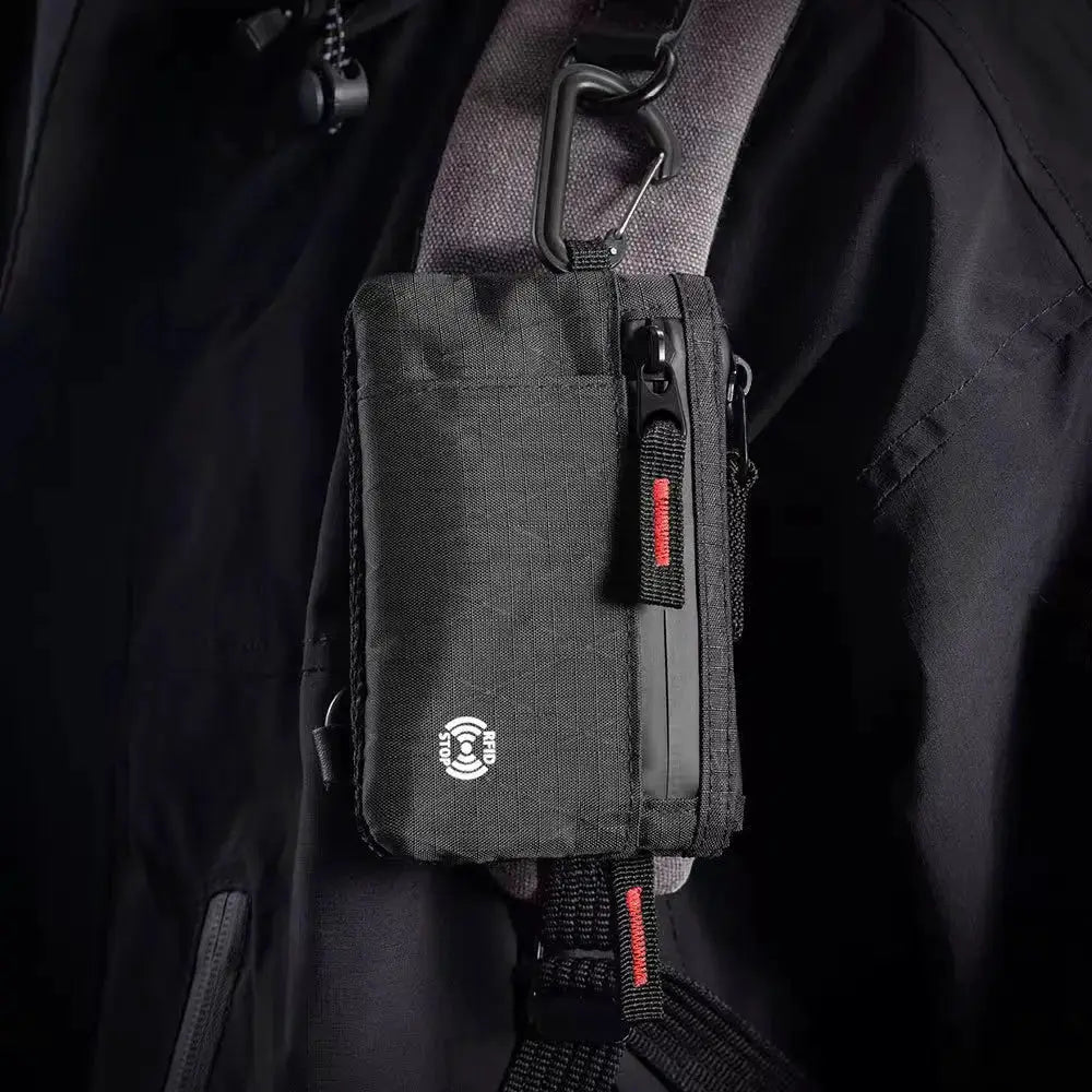 Simples Market RFID anti-theft ultra-thin wallet with multiple card slots; black compact accessory clipped to a strap.