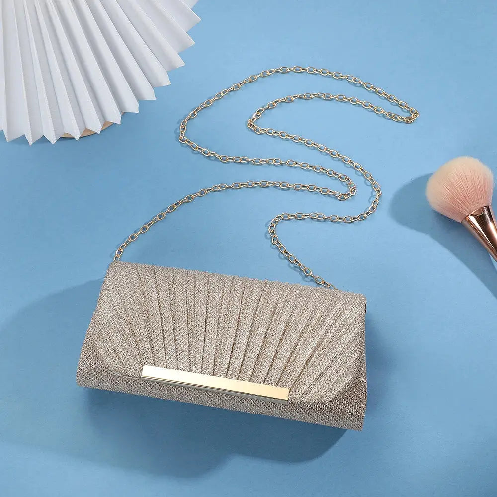 Sequined clutch bag with gold chain, champagne metallic finish for evening wear