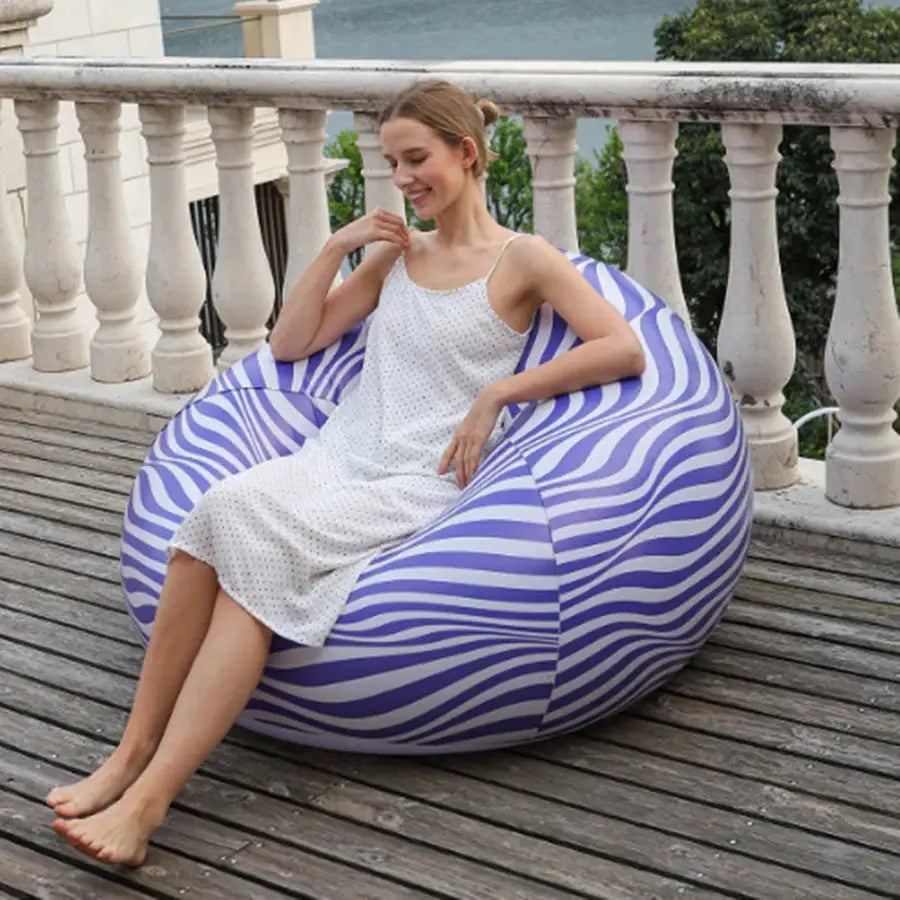 Large inflatable PVC sofa lounger with purple zebra stripes; outdoor living room bean bag chair.