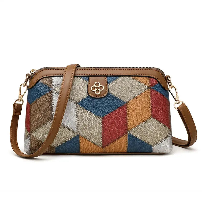 Small patchwork crossbody bag with multicolor panels and brown leather trim, gold hardware, Simples Market.