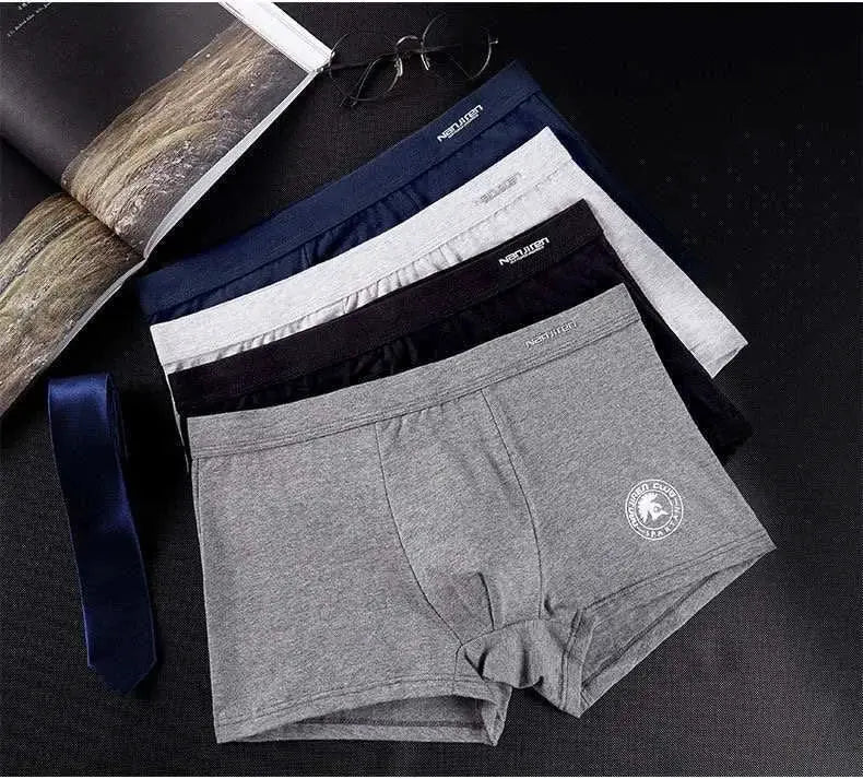 Five-pack of plus-size men's cotton boxer shorts in solid colors with a leg logo; Simples Market.