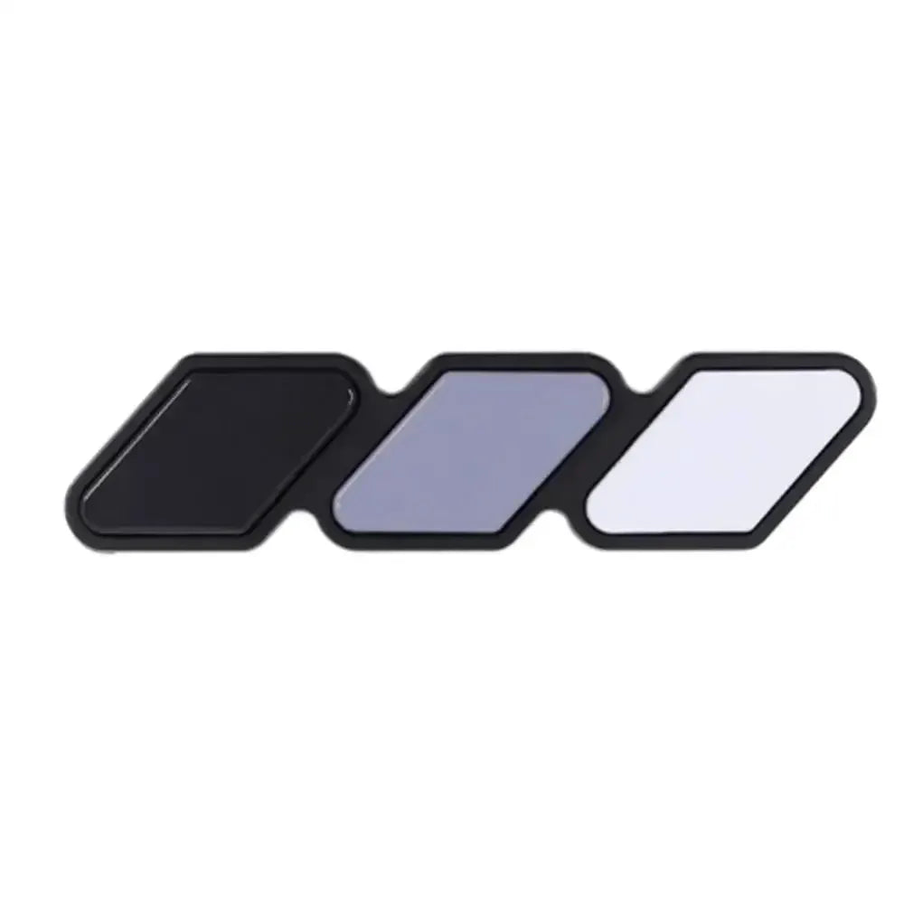 Simples Market 3-piece grille badge emblem set in black, blue-gray, and white for Toyota vehicles