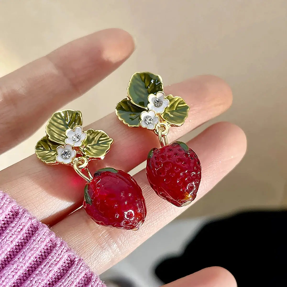Cross Border strawberry drop earrings with enamel green leaves and white flower accents (2 pcs) by Simples Market