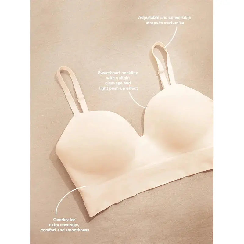 Women's nude wireless bra with molded cups, adjustable straps, and seamless band.