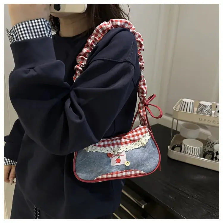 Small handheld crossbody bag by Simples Market, denim patch with red gingham trim and lace accents