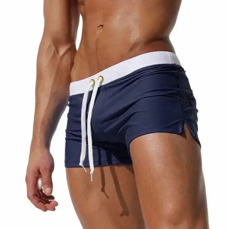 Men's navy blue swim trunks with white drawstring and waistband, quick-drying beach shorts