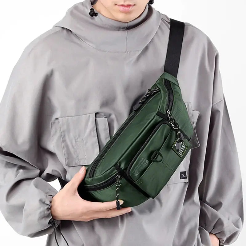 Simples Market green nylon military-style waist bag with multiple zip pockets and crossbody strap