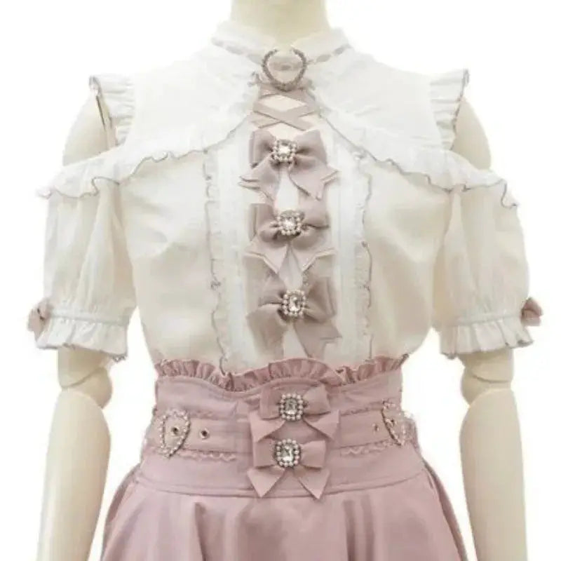 Sweet Lolita blouse by Simples Market with lace trim, off-shoulder sleeves, and pink bow belt.