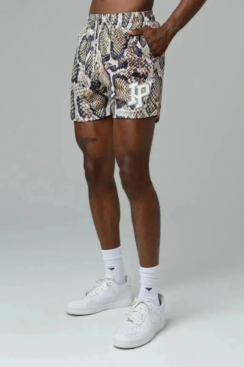 Men's snake-print quick-dry shorts by Simples Market; breathable mesh fabric with white logo patch.