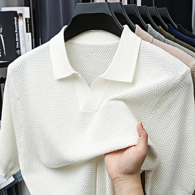 Polo shirt by Simples Market, white 100% cotton with knitted texture, men's short sleeves on hanger.