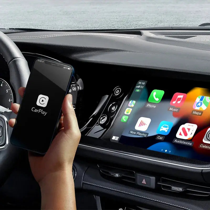 2-in-1 wireless Android Auto and CarPlay adapter in car; phone showing CarPlay on dashboard display