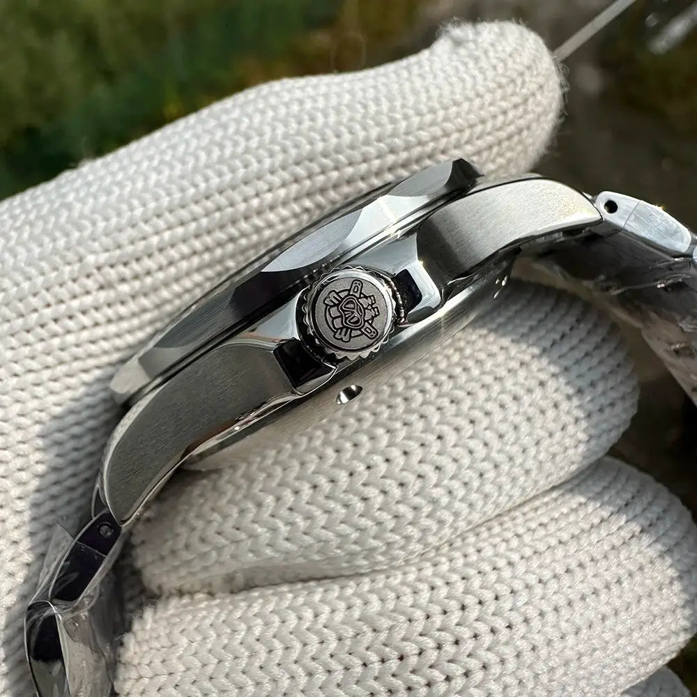 STEELDIVE SD1957 dive watch; brushed stainless steel case, crown logo, and metal bracelet
