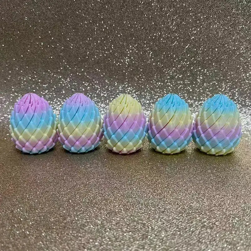 Dragon egg stress-relief twist set by Simples Market; five pastel rainbow 3D-printed eggs