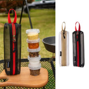 Simples Market portable camping spice kit; five clear spice bottles in a zippered bag with a red carrying loop