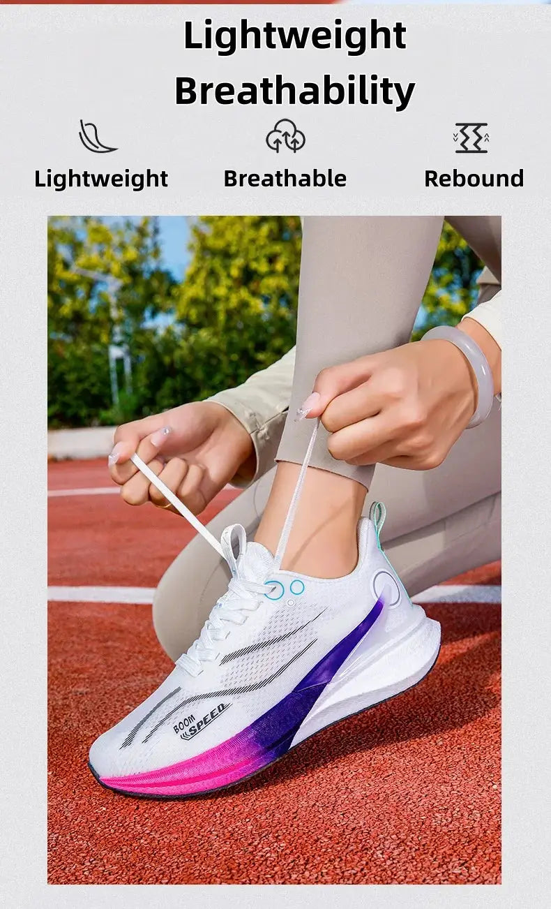 Unisex marathon running shoes in white mesh upper with purple-pink gradient sole, laces tied on track