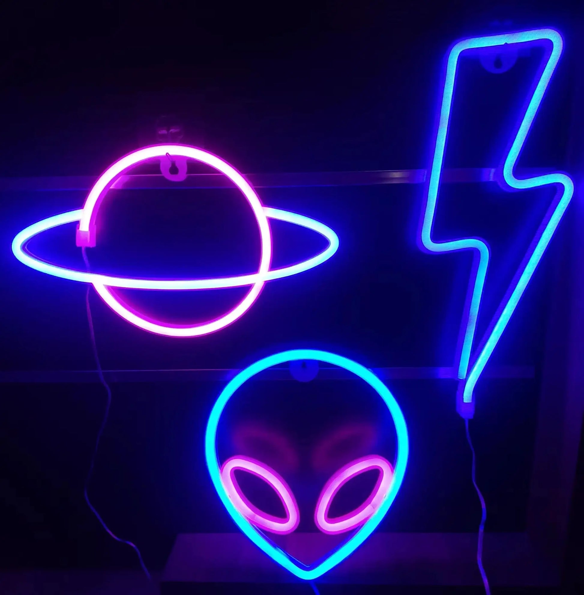 Decorative neon light wall art in blue and pink with abstract shapes for modern ambiance.