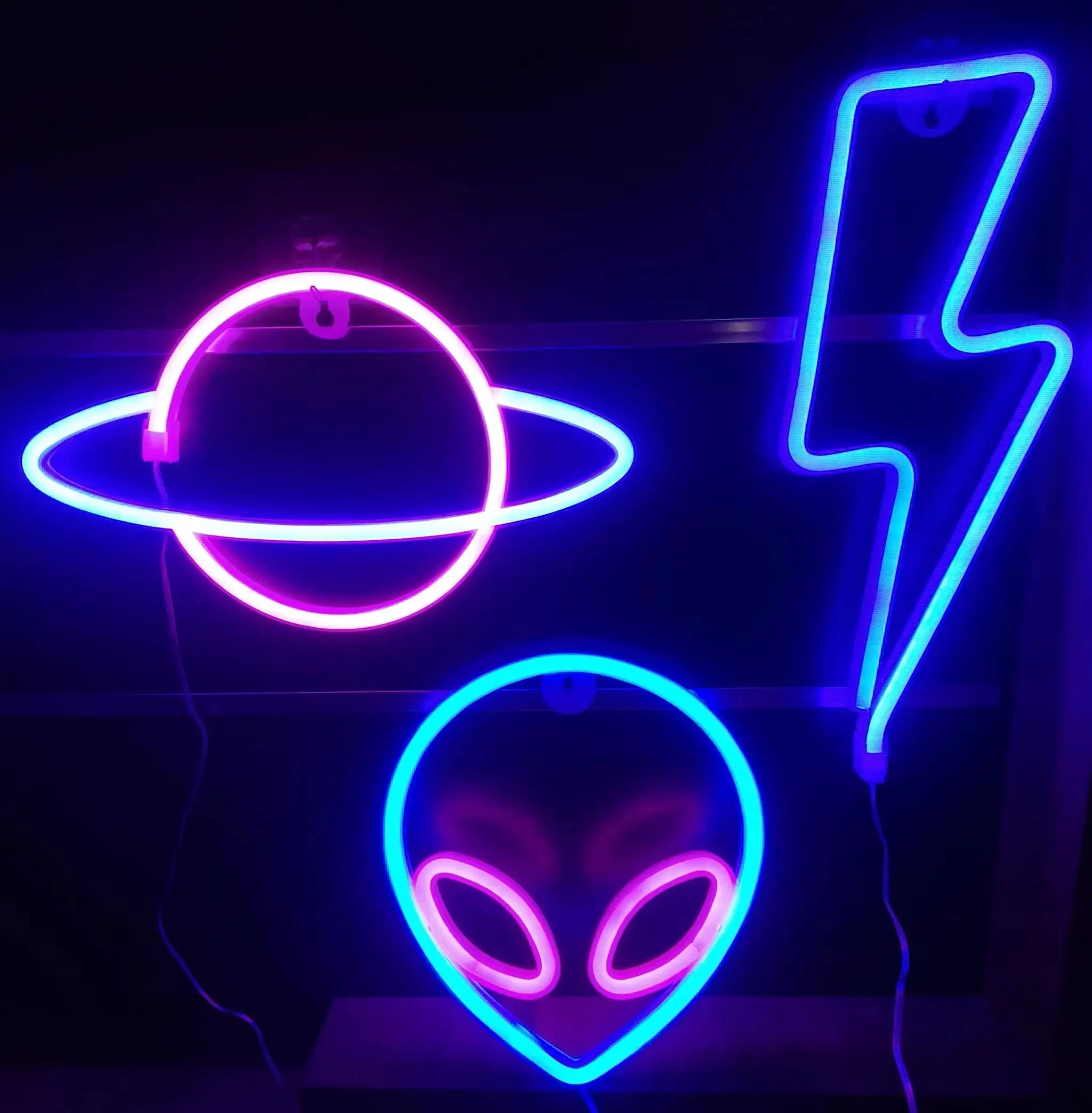 Decorative neon light wall art in blue and pink with abstract shapes for modern ambiance.