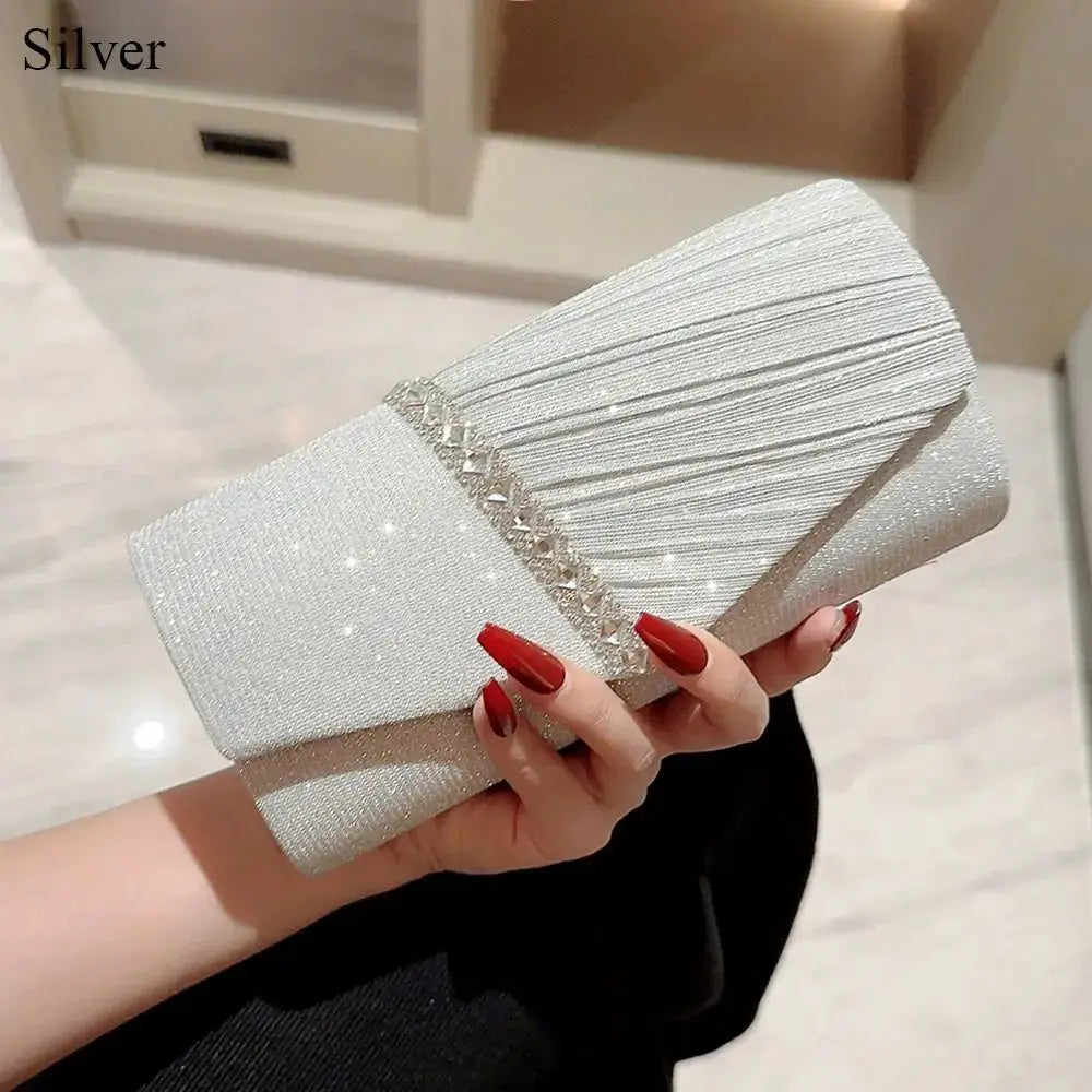 Silver sequin clutch bag with glittery texture and crystal chain accent for evenings