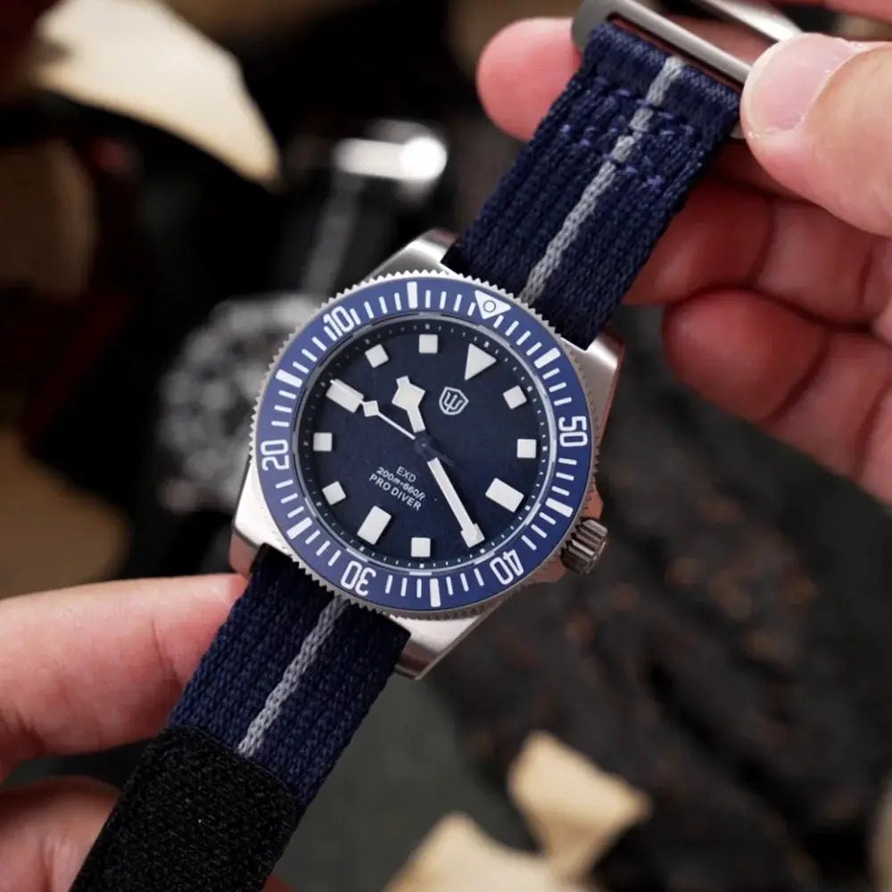 Watchdives EXD 40mm blue dial dive watch with blue bezel on navy fabric strap