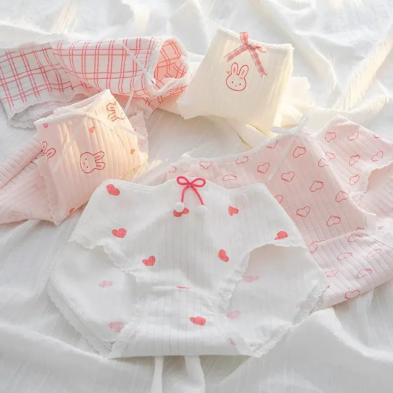 5-piece cotton underwear set; women's briefs in white and pink with bow accents and heart/bunny prints.