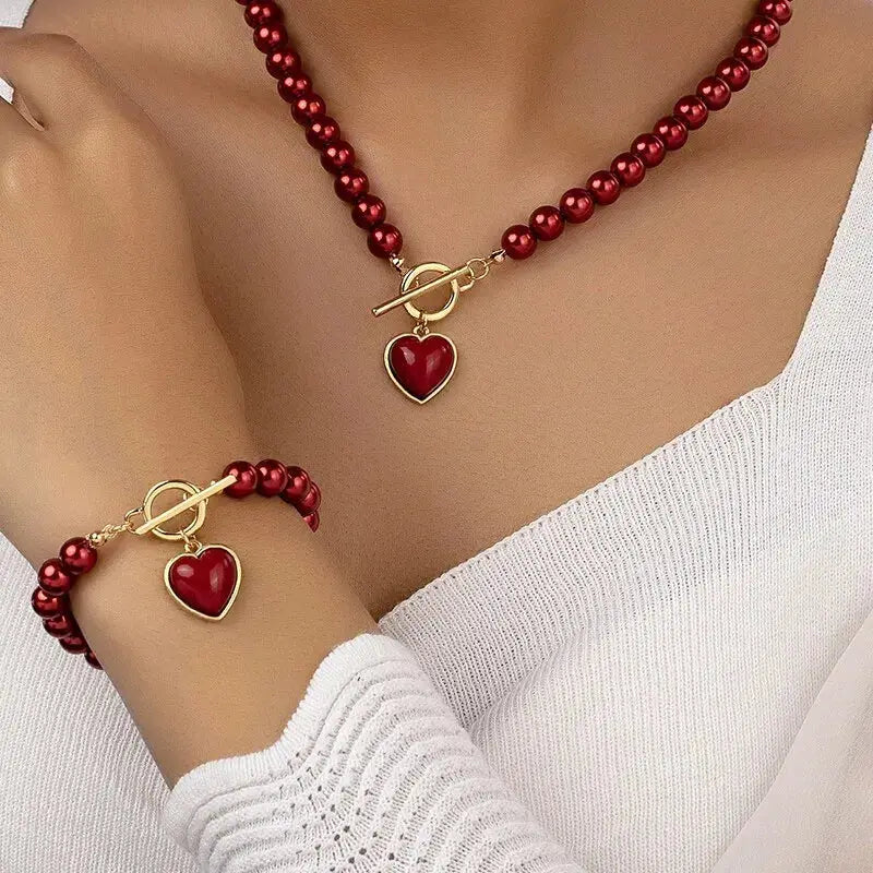 Simples Market red bead necklace and bracelet set with gold-tone toggle clasp and heart pendants