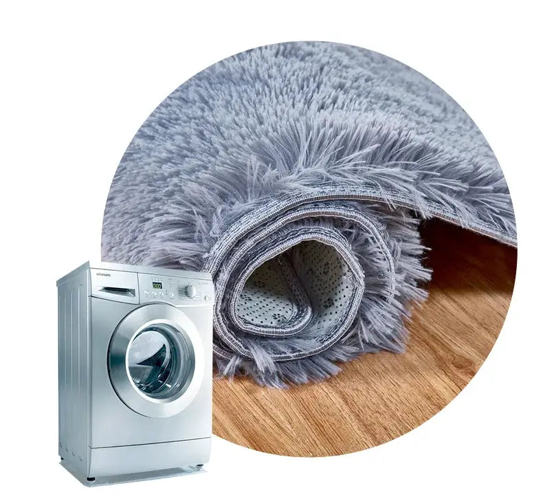 Kids fluffy blue-gray shag rug rolled on wood floor beside a washing machine