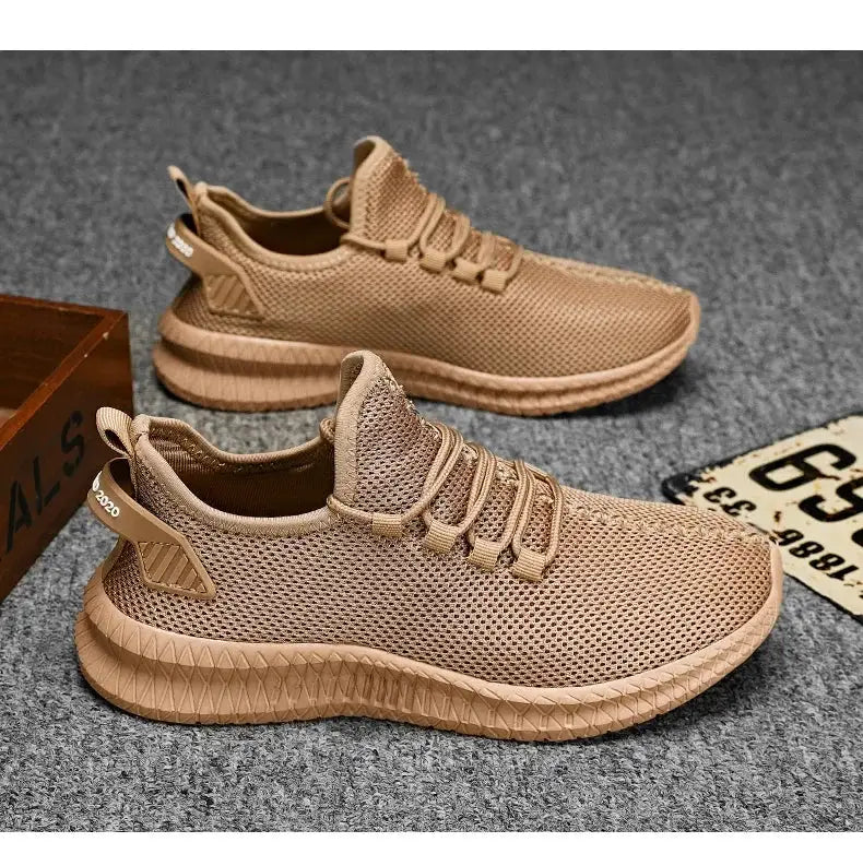Two men's tan knit lace-up sneakers with breathable mesh and non-slip soles.