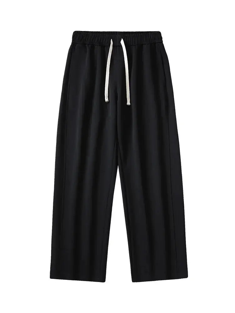 Men's black wide-leg sweatpants with white drawstring, elastic waistband, casual track pants