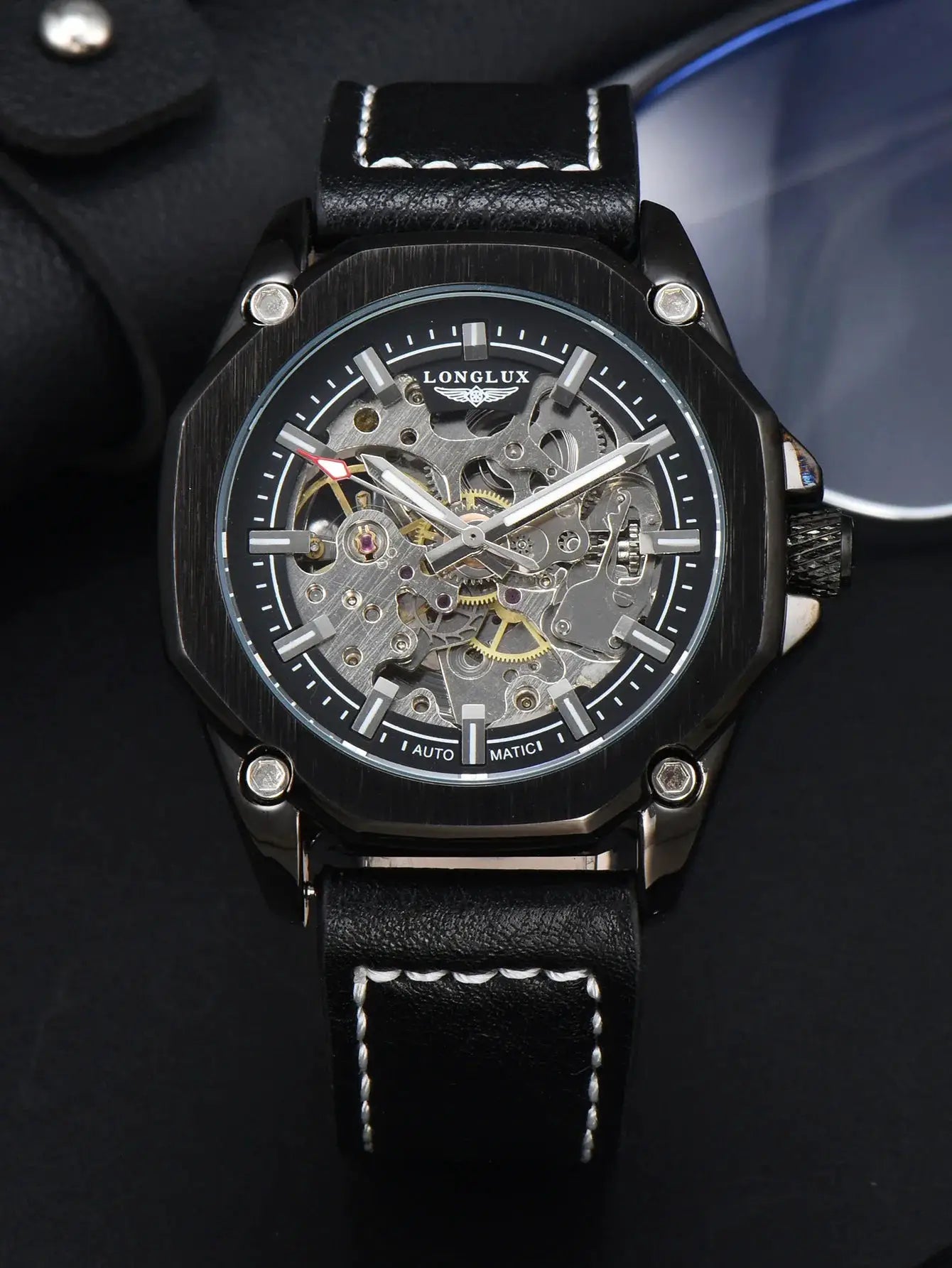 LONG LUX men's skeleton automatic watch with black brushed case, exposed gears, and leather strap with white stitching.