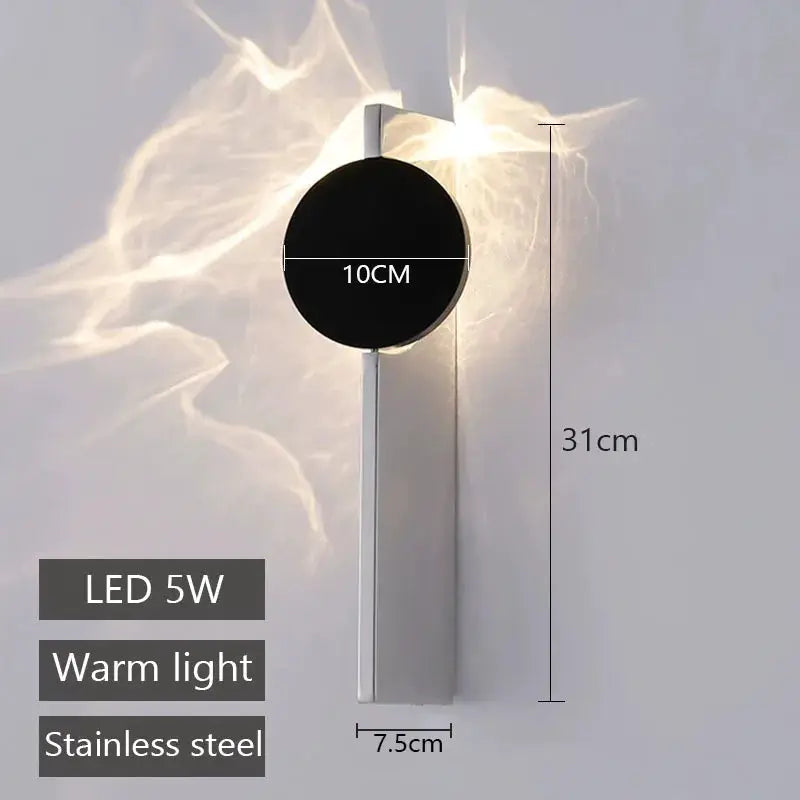 Modern LED wall light by Simples Market, rotatable stainless steel lamp with 10 cm black disk, 5W warm light