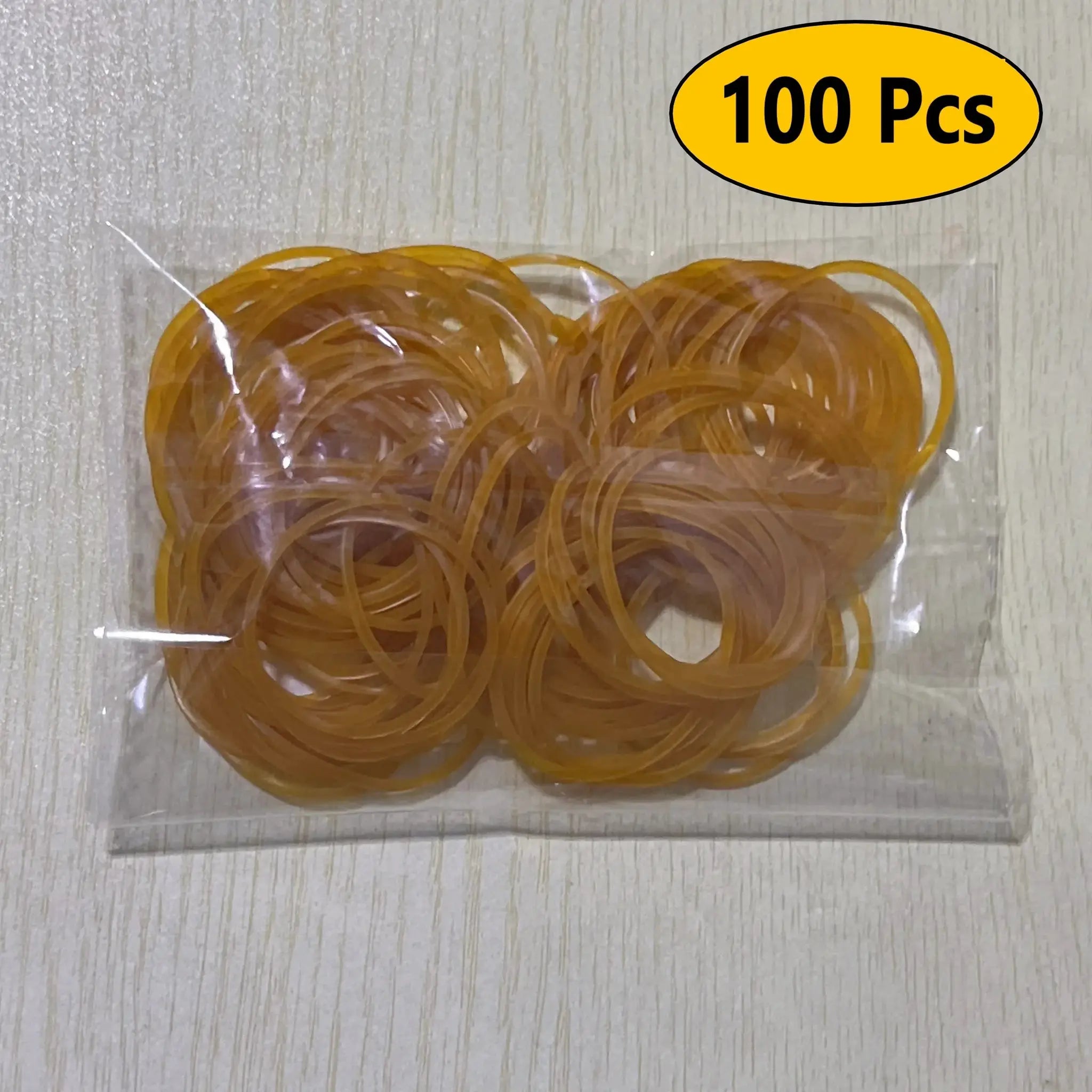 Yellow elastic rubber bands in a clear bag, 100 pcs, 38 mm diameter, natural rubber