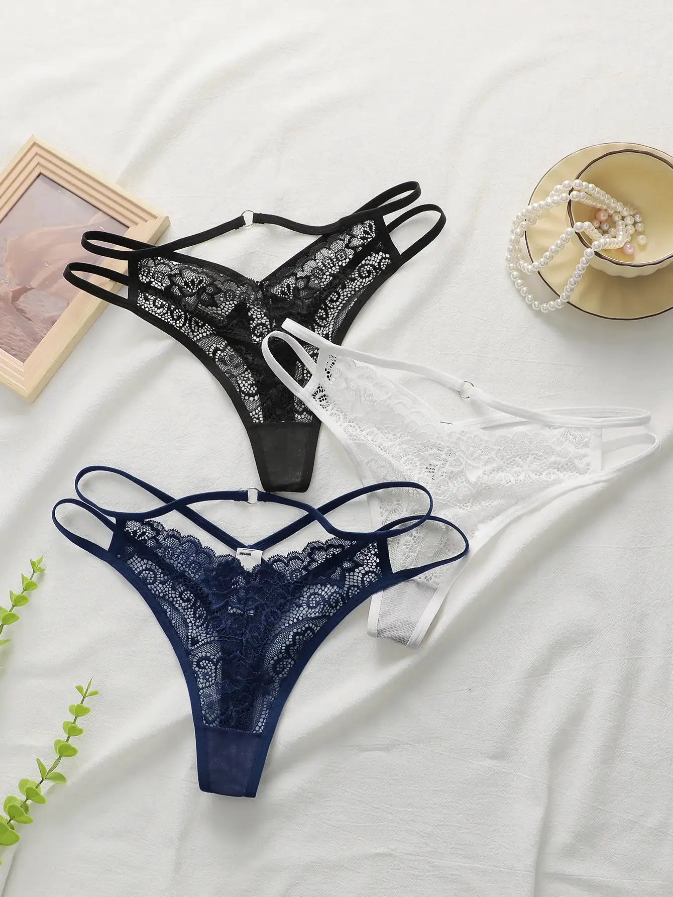 3-pack lace thongs in black, white and navy; lightweight, easy-care women's underwear.