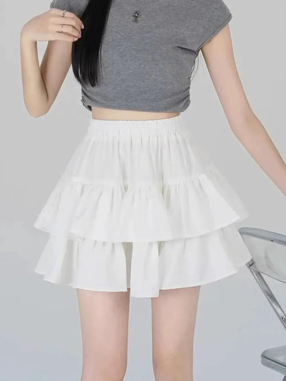 White tiered ruffle mini skirt with high-waist silhouette